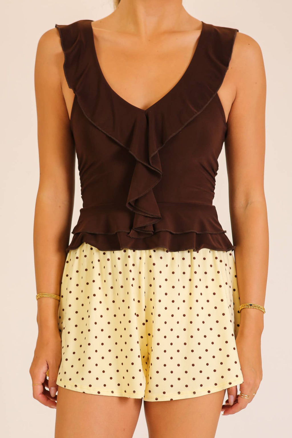 Ruffle Trim Sleeveless Peplum Top