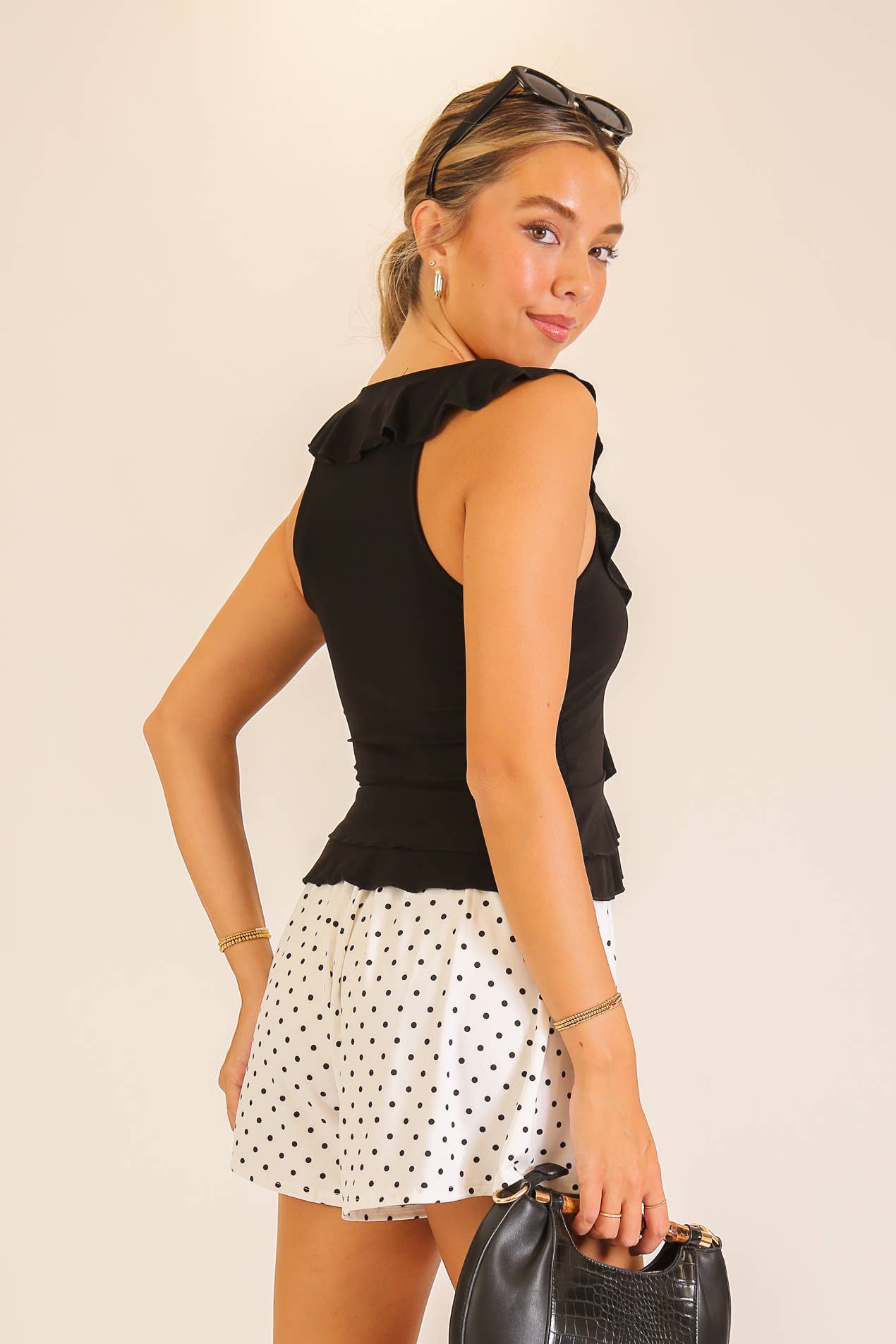 Ruffle Trim Sleeveless Peplum Top: Cream