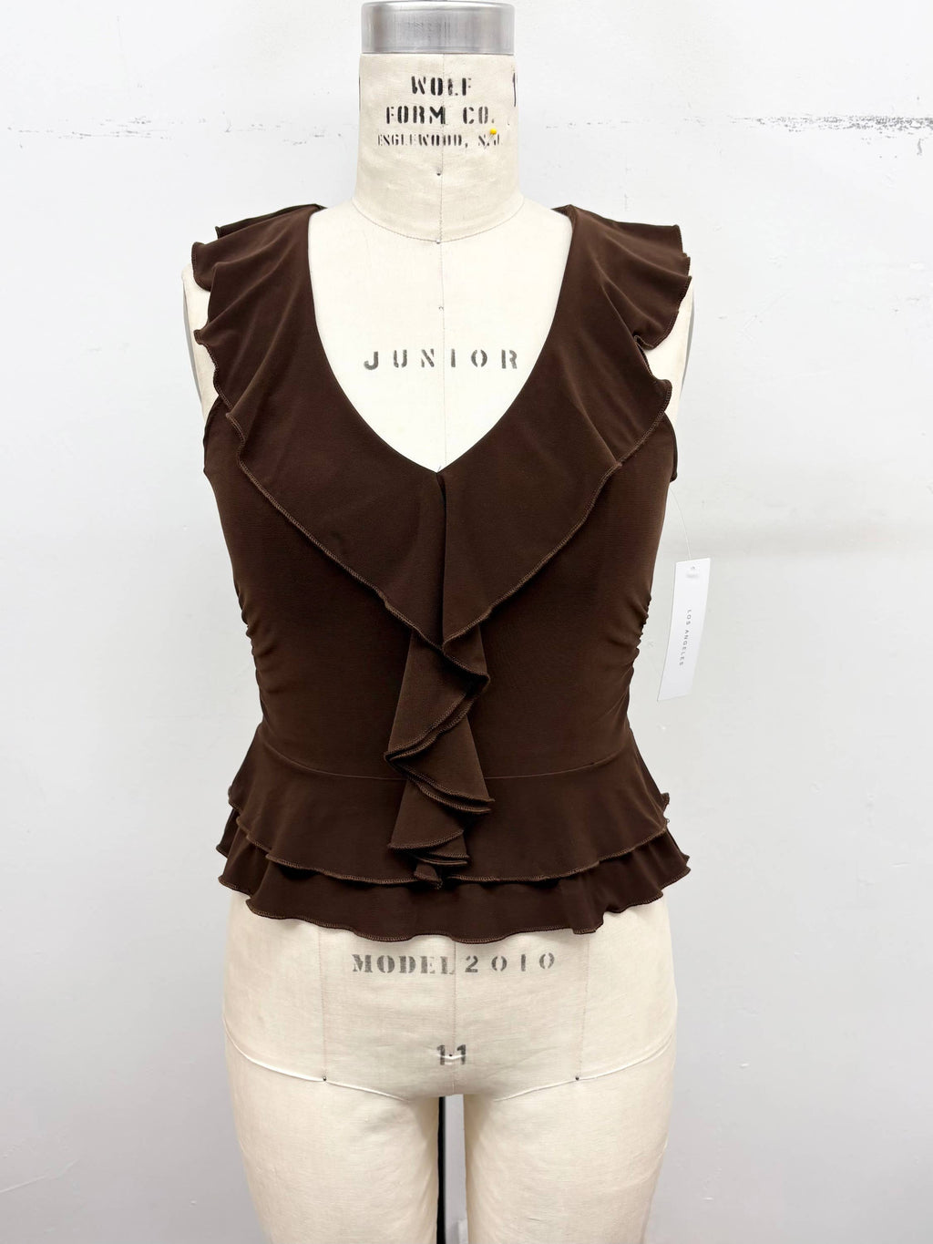 Ruffle Trim Sleeveless Peplum Top