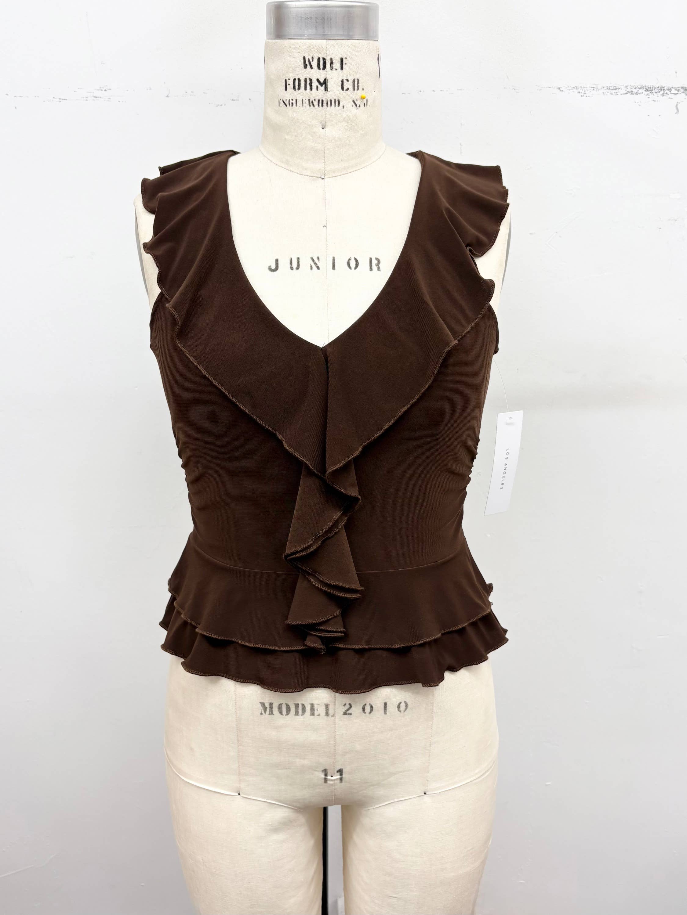 Ruffle Trim Sleeveless Peplum Top: Cream