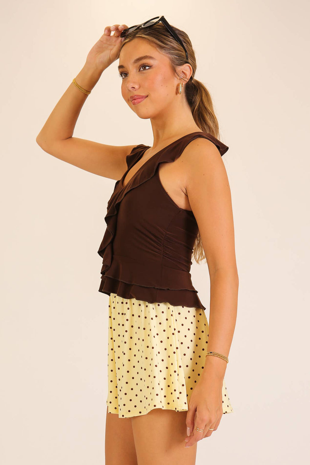 Ruffle Trim Sleeveless Peplum Top: Black