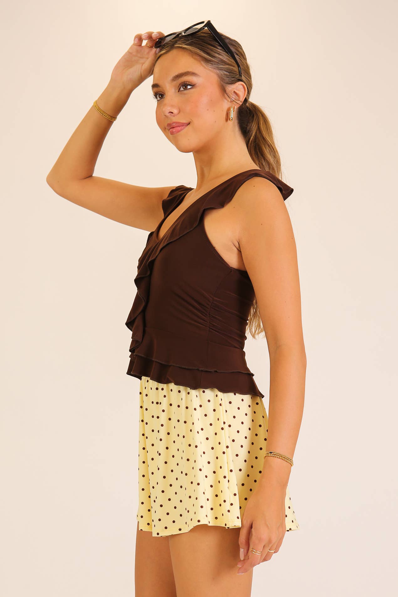 Ruffle Trim Sleeveless Peplum Top