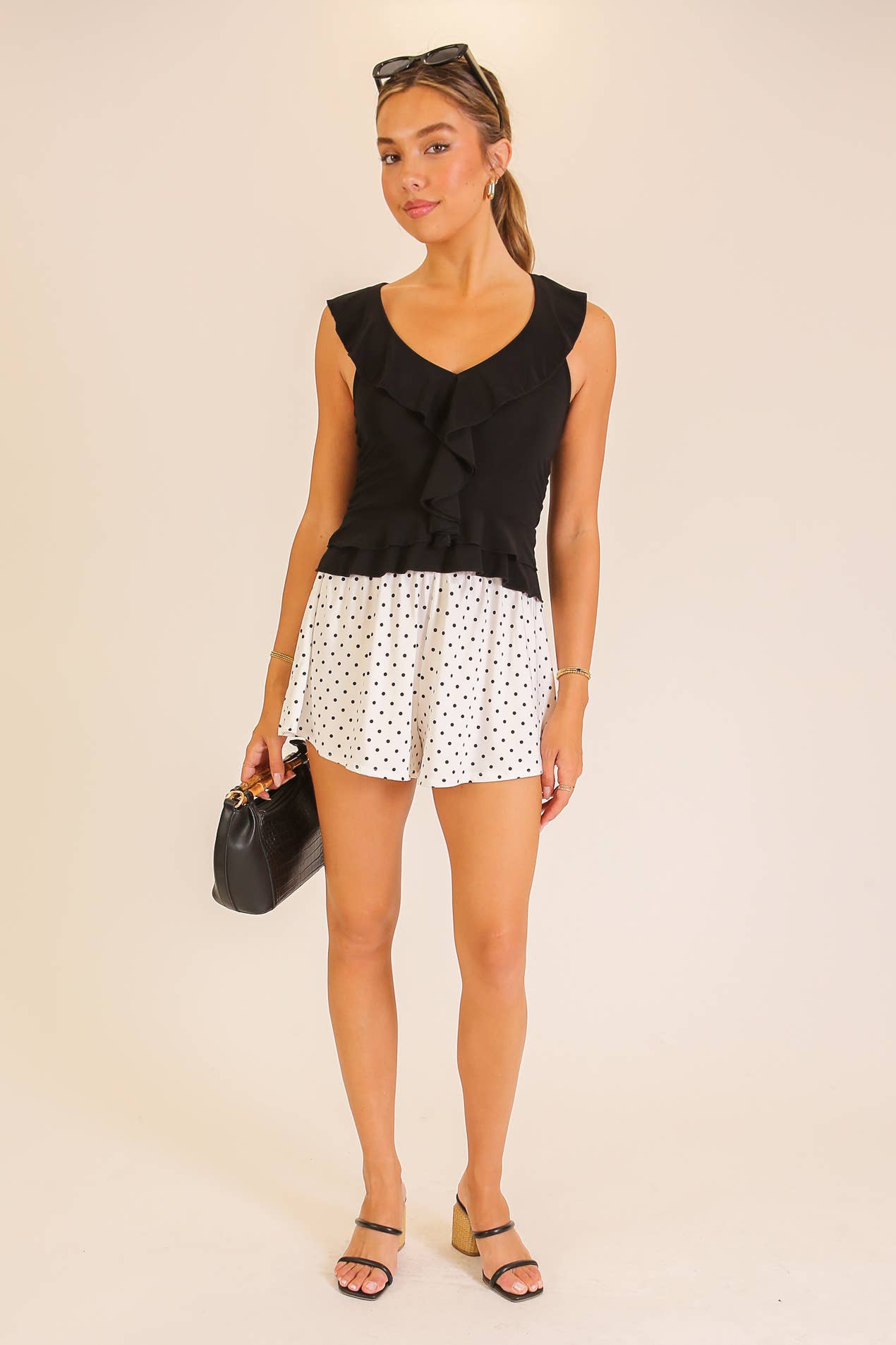 Ruffle Trim Sleeveless Peplum Top: Black