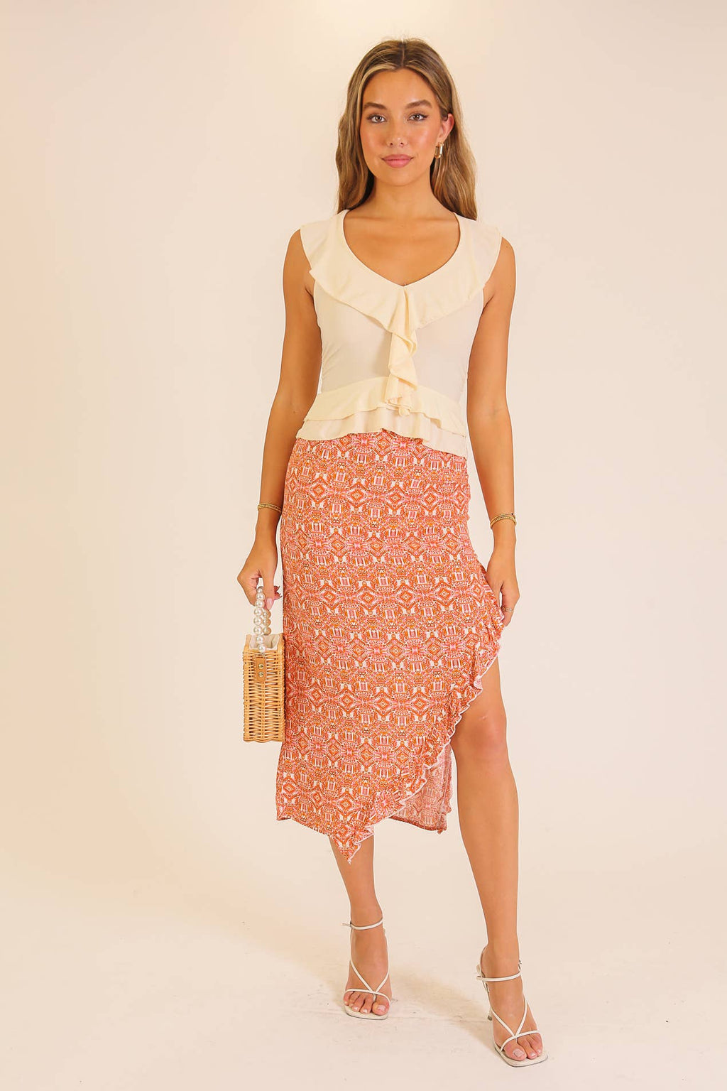 Ruffle Trim Sleeveless Peplum Top: Cream