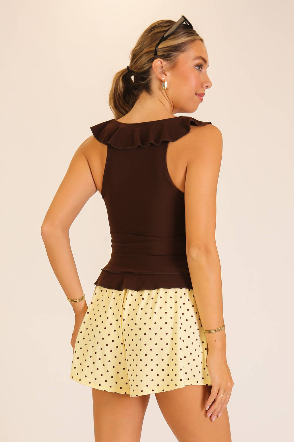 Ruffle Trim Sleeveless Peplum Top: Black