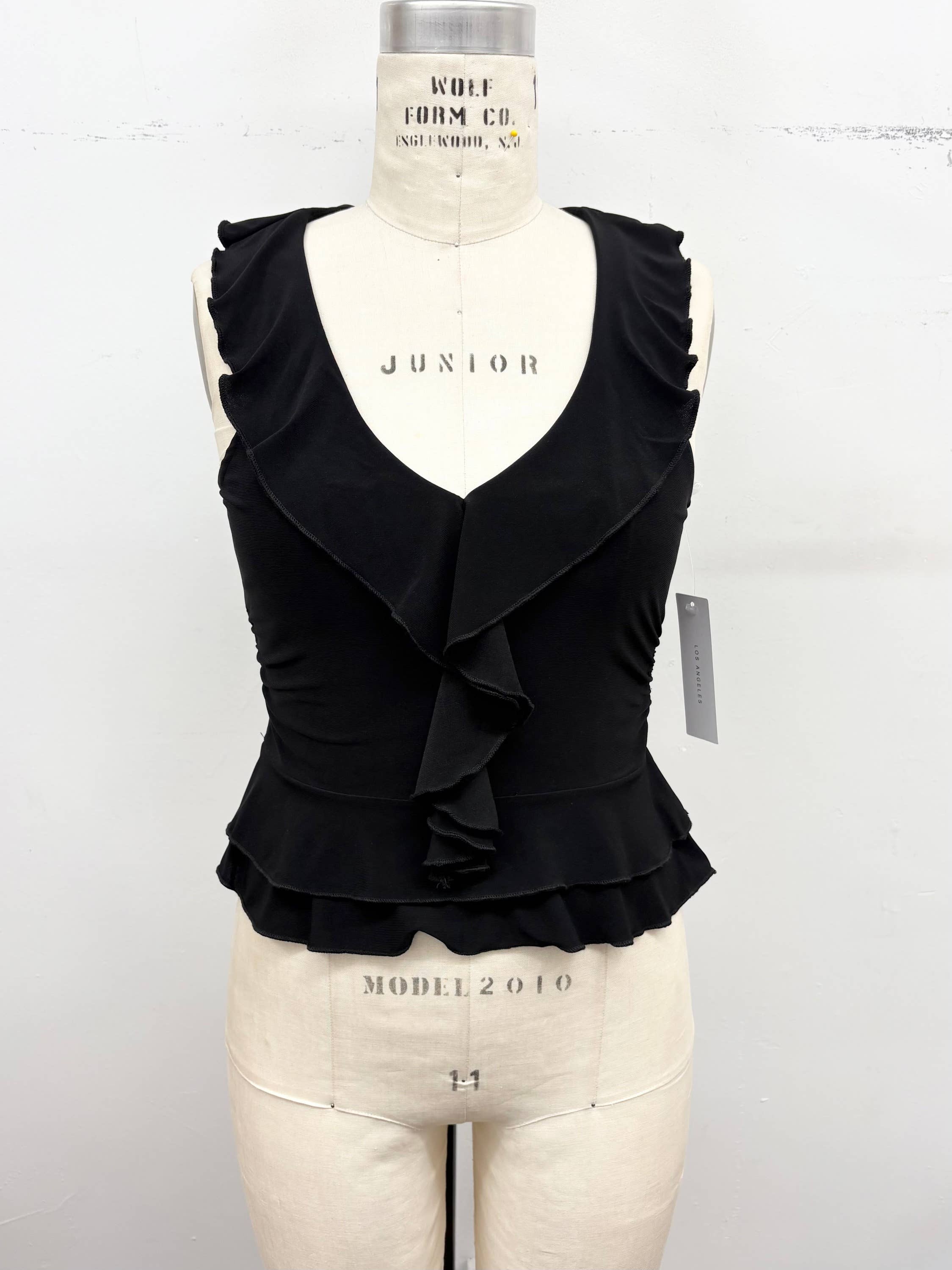 Ruffle Trim Sleeveless Peplum Top: Cream