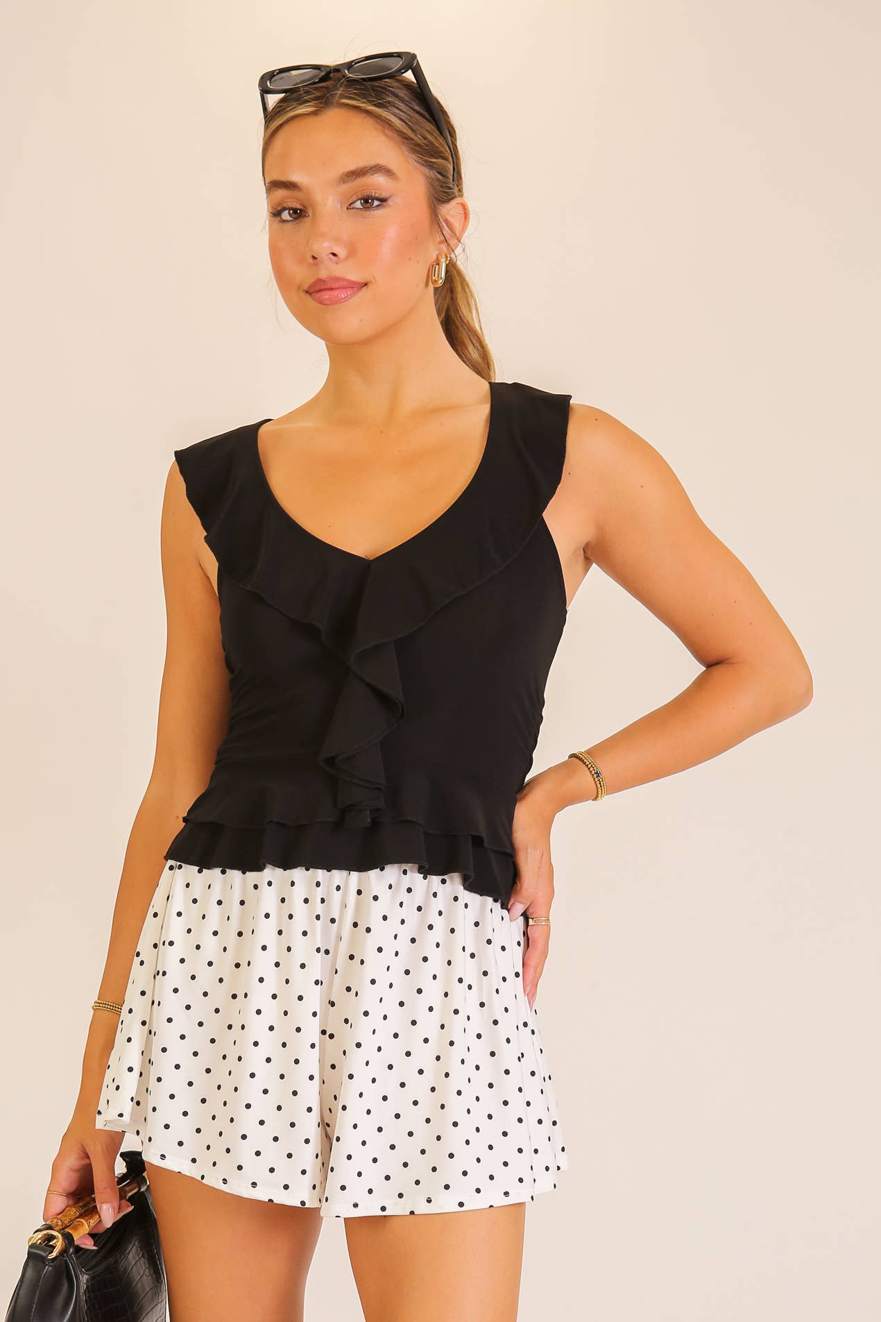 Ruffle Trim Sleeveless Peplum Top: Black